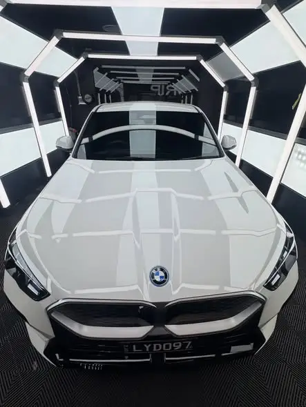 Close-up of white BMW paint with a gloss ceramic coating finish